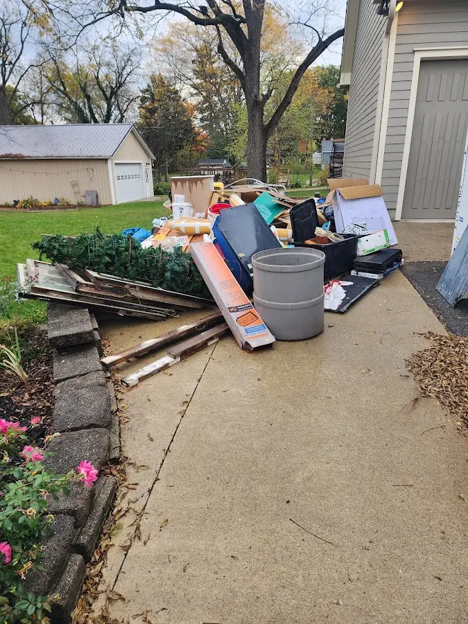 Dumpster being loaded with debris for Demolition Dumpster Rental in Amwell
